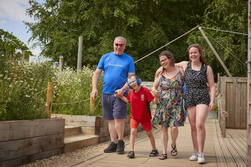 A family enjoying a visit to Cotswold Farm Park 4