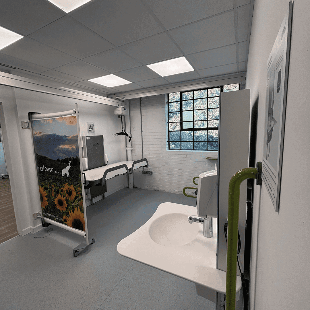 1 a bathroom with a picture on the wall