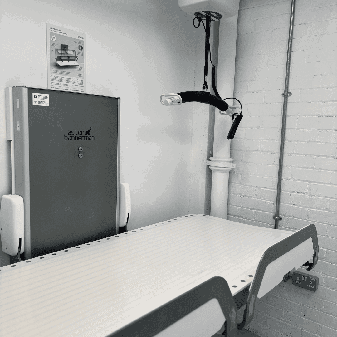 a room with a stretcher and a wall